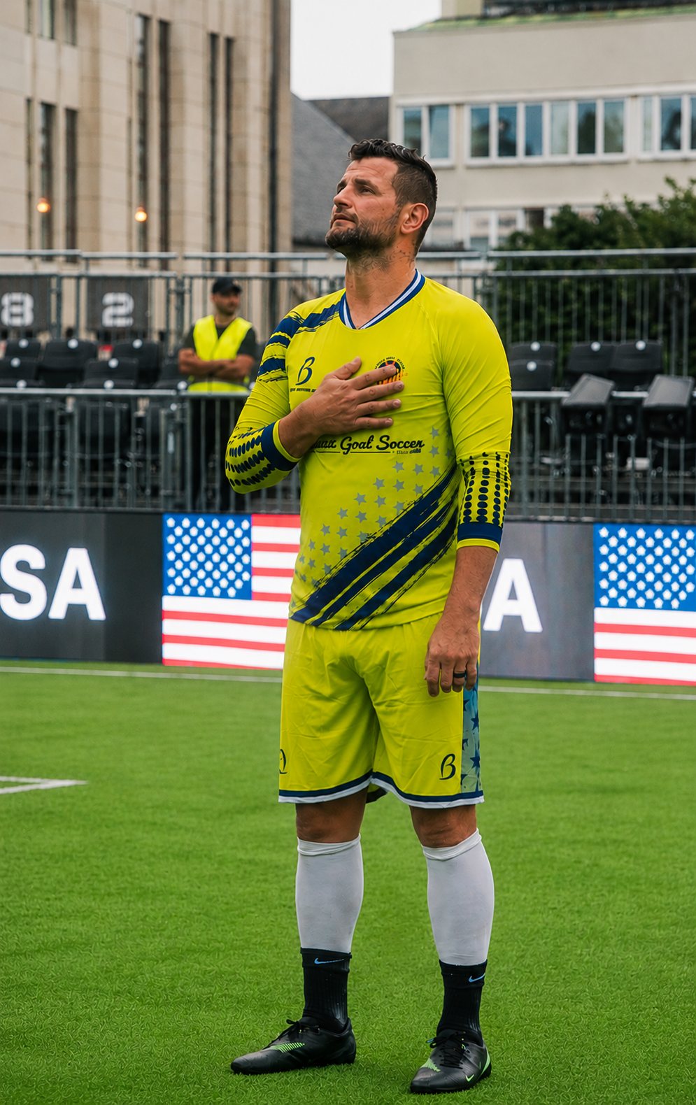 Devala Gorrick standing for the anthem with Team USA at the World Cup